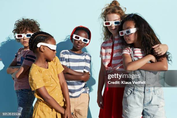 group shot of cool kids wearing 3-d glasses while playing and posing - tough love stock pictures, royalty-free photos & images