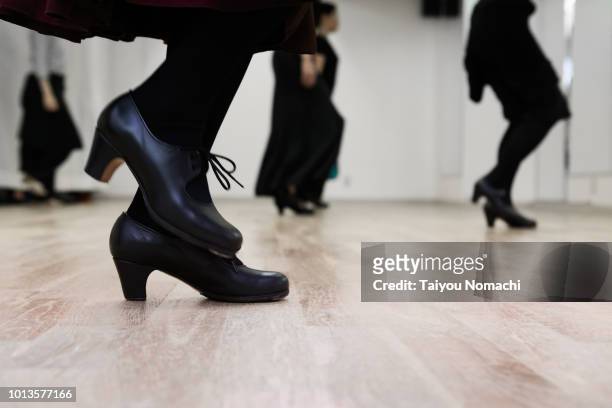 flamenco dancer kicking the floor - flamenco foto e immagini stock