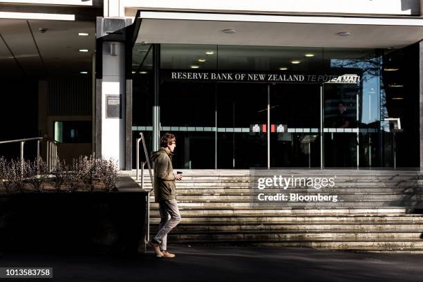 Pedestrian walks past the Reserve Bank of New Zealand headquarters in Wellington, New Zealand, on Thursday, Aug. 9, 2018. New Zealand's central bank...