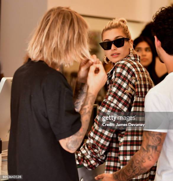Hailey Baldwin and Justin Bieber visit Cutler hair salon in SoHo on August 8, 2018 in New York City.