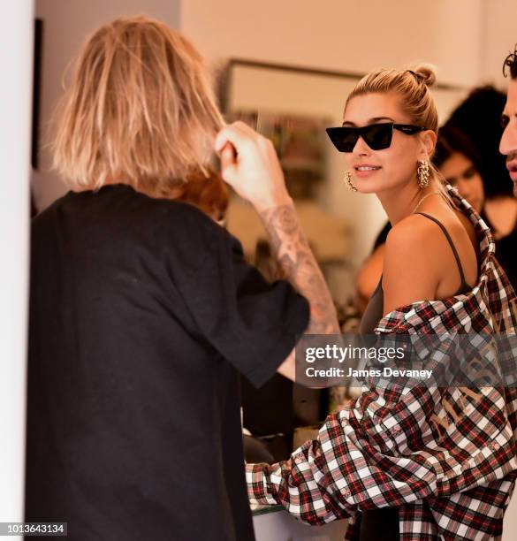 Hailey Baldwin and Justin Bieber visit Cutler hair salon in SoHo on August 8, 2018 in New York City.