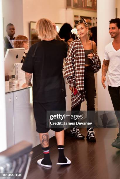 Hailey Baldwin and Justin Bieber visit Cutler hair salon in SoHo on August 8, 2018 in New York City.