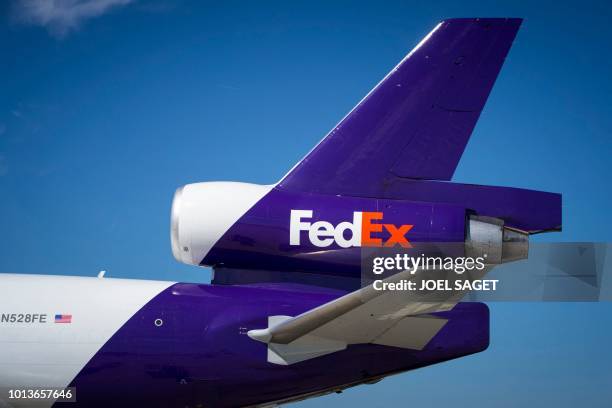 This photograph taken on August 6 shows a McDonnell Douglas MD11 aircraft of US parcel delivery giant FedEx on the tarmac at Roissy-Charles de Gaulle...