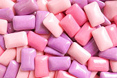Gum. A various shades of pink and purple gum for food pattern and background.