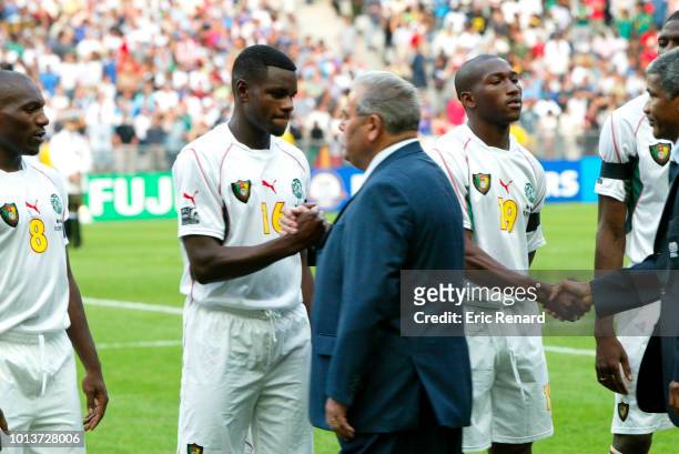 Valery Mezague of Cameroon and Clause Simonet, french president of federation during the Confederation Cup Final match between Cameroon and France at...