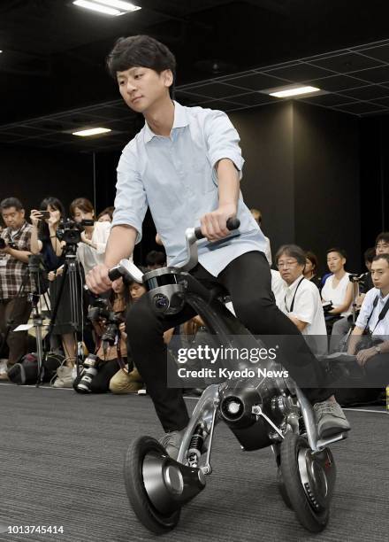 File photo shows a man riding "CanguRo" in Tokyo on July 4, 2018. The Future Robotics Technology Center of Chiba Institute of Technology has...