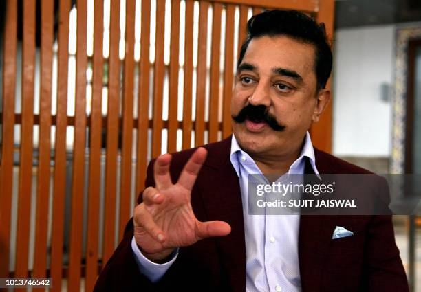 In this photograph taken on July 31, 2018 Indian Bollywood film actor, director, screenwriter, and producer Kamal Haasan speaks during an interview...