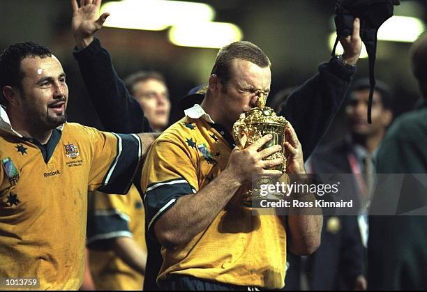 Richard Harry of Australia kisses the Webb Ellis trophy after winning the Final of the 1999 Rugby World Cup against France played at the Millennium...