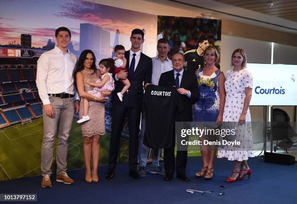 New signing Thibaut Courtois of Real Madrid is accompanied by his children and family during the presentation by Real Madrid president Florentino...