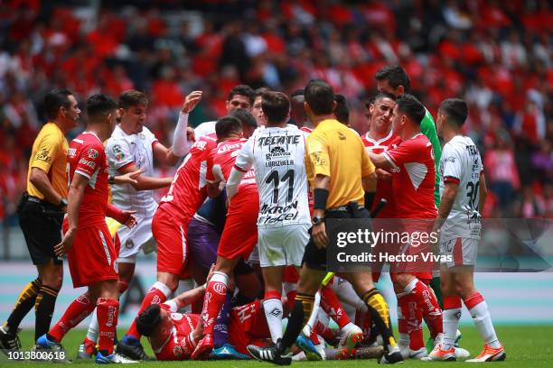 Players of Toluca and Chivas fight during the third round match between Toluca and Chivas as part of the Torneo Apertura 2018 Liga MX at Nemesio Diez...