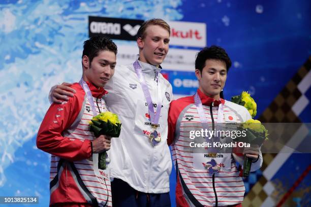 Silver medalist Kosuke Hagino of Japan, gold medalist Chase Kalisz of the United States and bronze medalist Daiya Seto of Japan pose for photographs...