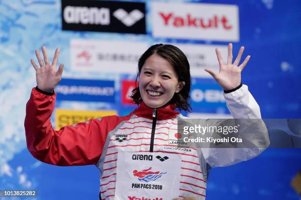 Gold medalist Yui Ohashi of Japan celebrates on the podium at the medal ceremony for the Women's 400m Individual Medley on day one of the Pan Pacific...