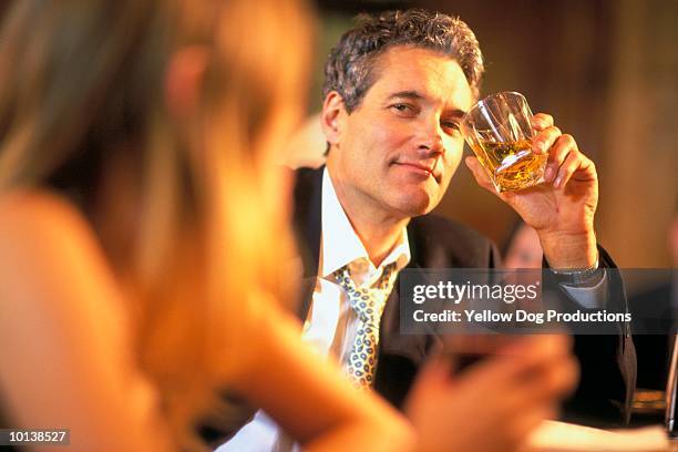 man picks up woman at a bar - flirting stockfoto's en -beelden