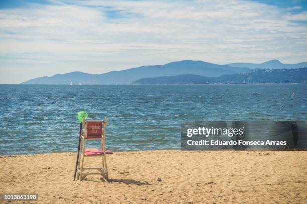 lifeguard on a beach - english bay stock-fotos und bilder