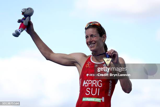 Nicola Spirig of Switzerland poses with her gold medal after winning the women's triathlon on Day eight of the European Championships Glasgow 2018 at...
