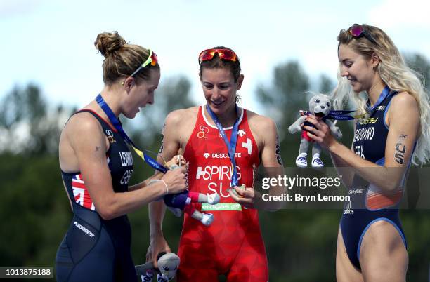 Bronze medalist Cassandre Beaugrand of France, Silver medalist Jess Learmonth of Great Britain, and Gold medalist Nicola Spirig of Switzerland pose...