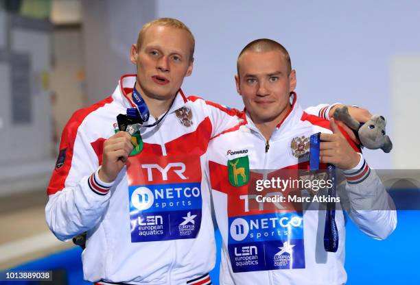 Silver medalist Ilia Zakharov of Russia and Bronze medalist Evgenii Kuznetsov of Russia pose with their respective medals after the Men's 3m...