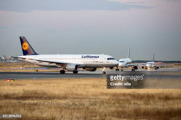 lufthansa airbus taking off at runway 18 west - lufthansa stock pictures, royalty-free photos & images