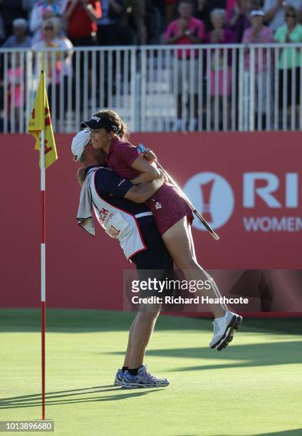 Georgia Hall of England celebrates with her father who caddied for her after finishing the final round and winning the tournament during day four of...