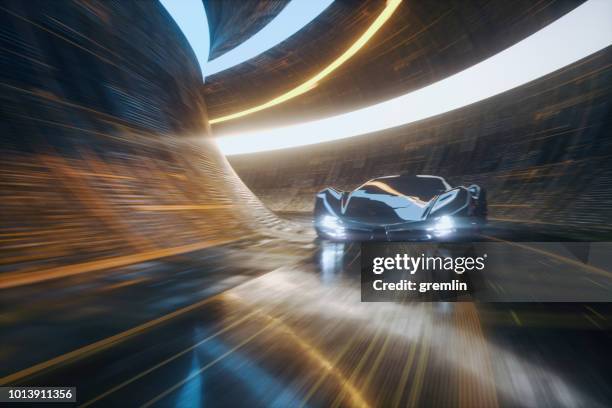 generic futuristic sports car speeding in the underground tunnel - motorsport car stock pictures, royalty-free photos & images