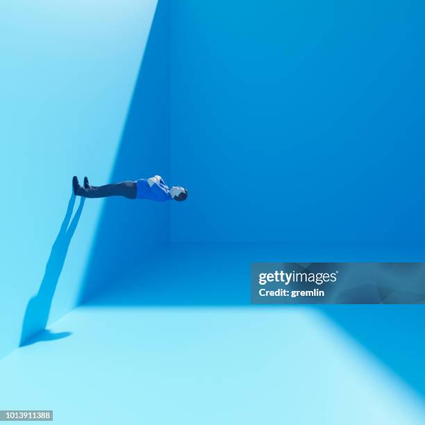 surreal businessman standing in cubic room - blue room stock pictures, royalty-free photos & images