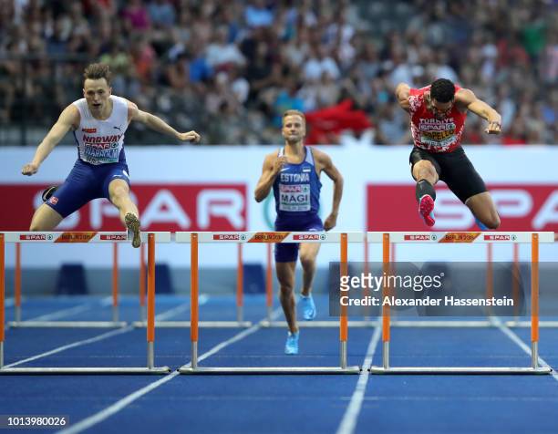 Karsten Warholm of Norway and Yasmani Copello of Turkey compete in the Men's 400m Hurdles Final during day three of the 24th European Athletics...