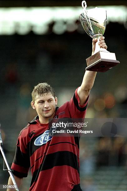 Todd Blackadder of Canterbury holds the trophy aloft after the Super 12's final against Auckland at Eden Park in Auckland, New Zealand. Canterbury...