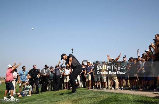 Player Stephen Curry of the Golden State Warriors hits his second shot on the 15th hole during Round One of the Ellie Mae Classic at TBC Stonebrae on...