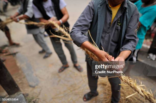 Nepalese devotees making straw effigy demon Ghantakarna during the Gathemangal festival celebrated at Thimi, Bhaktapur, Nepal on Thursday, August 09,...