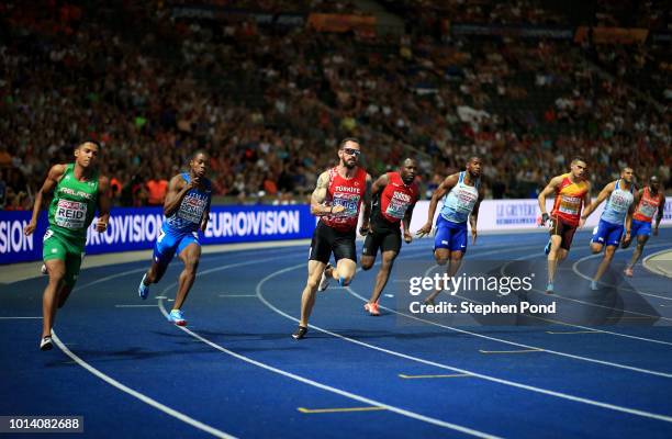 Ramil Guliyev of Turkey competes during the Men's 200m Final during day three of the 24th European Athletics Championships at Olympiastadion on...