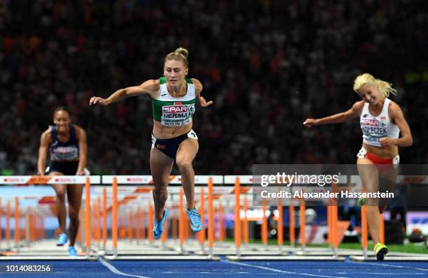 Elvira Herman of Belarus crosses the finish line in the Women's 100m Hurdles Final during day three of the 24th European Athletics Championships at...