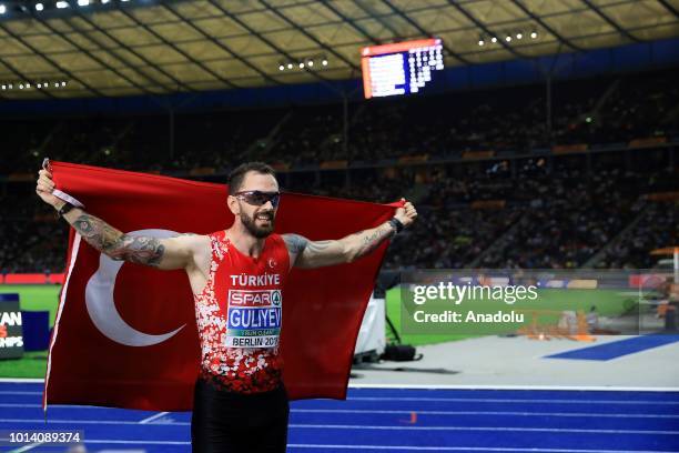 Turkish athlete Ramil Guliyev celebrates after winning the gold medal with 19.76 seconds in 200-meter men's race final during the fourth day of the...