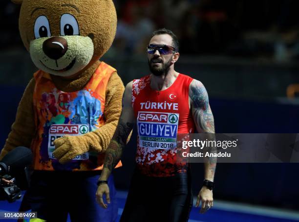 Turkish athlete Ramil Guliyev celebrates after winning the gold medal with 19.76 seconds in 200-meter men's race final during the fourth day of the...