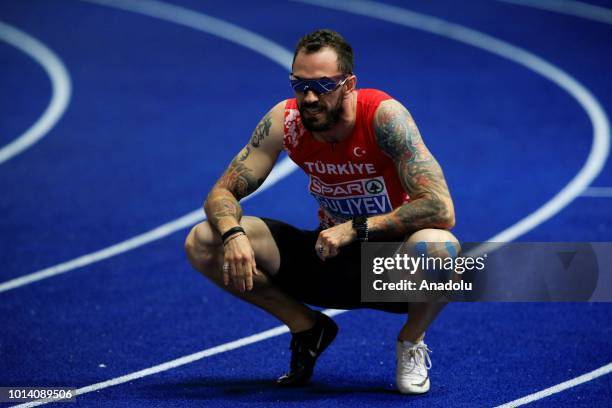 Turkish athlete Ramil Guliyev celebrates after winning the gold medal with 19.76 seconds in 200-meter men's race final during the fourth day of the...