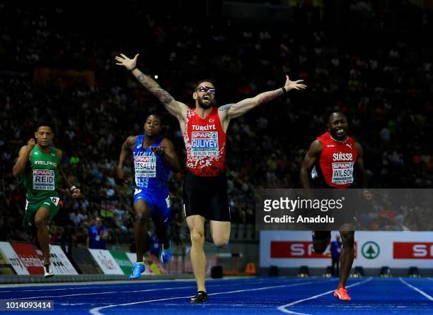 Turkish athlete Ramil Guliyev celebrates after winning the gold medal with 19.76 seconds in 200-meter men's race final during the fourth day of the...