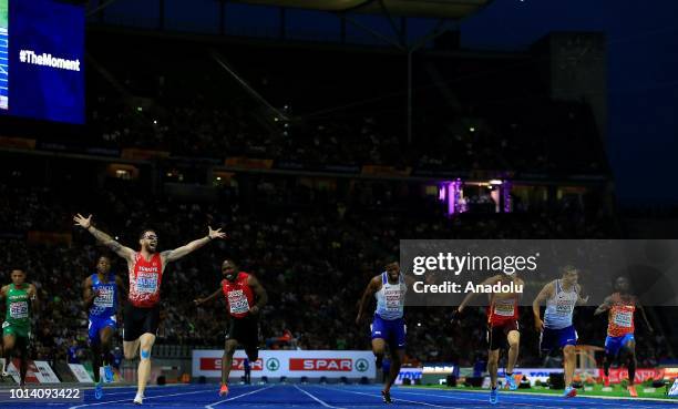 Turkish athlete Ramil Guliyev celebrates after winning the gold medal with 19.76 seconds in 200-meter men's race final during the fourth day of the...