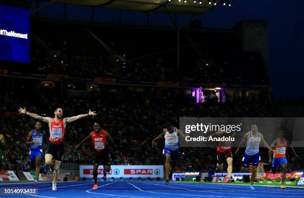 Turkish athlete Ramil Guliyev celebrates after winning the gold medal with 19.76 seconds in 200-meter men's race final during the fourth day of the...