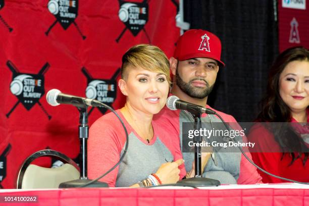 Deidre Pujols, Albert Pujols and Susan Kang Schroeder attend the Strike Out Slavery Press Conference at Angel Stadium on August 9, 2018 in Anaheim,...