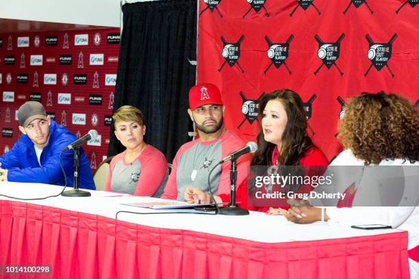 Singer-songwriter Nick Jonas, Deidre Pujols, Albert Pujols, Susan Kang Schroeder and Survivor Advocate Stacy Jewell attend the Strike Out Slavery...