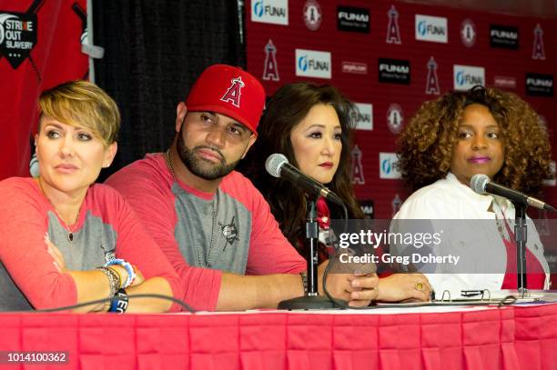 Deidre Pujols, Albert Pujols, Susan Kang Schroeder and Survivor Advocate Stacy Jewell attend the Strike Out Slavery Press Conference at Angel Stadium...