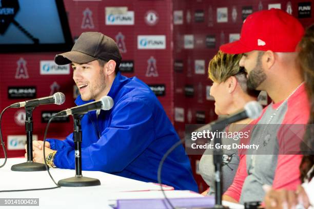 Singer-Songwriter Nick Jonas, Deidre Pujols and Albert Pujols attend the Strike Out Slavery Press Conference at Angel Stadium on August 9, 2018 in...