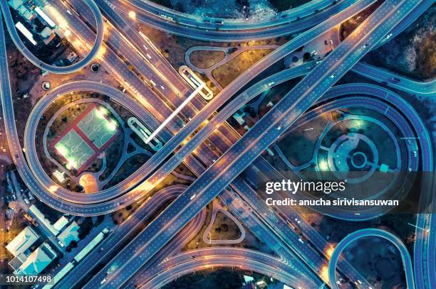 aerial view, expressway road intersection, traffic in bangkok at night, thailand. - crossroad top view stockfoto's en -beelden