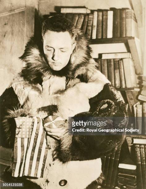 Admiral Byrd just before taking off for the South Pole, Byrd holds the flag which he was to drop at the Pole, Arctic, 1929.