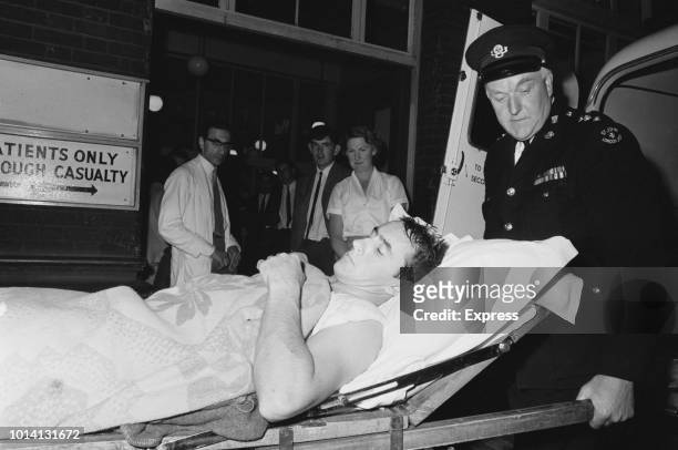 British former Formula One racing driver Jackie Stewart as he is transferred by ambulance to St Thomas' Hospital to recover from his injuries...
