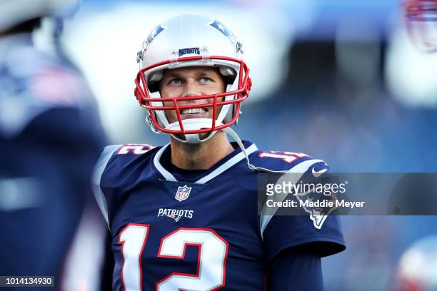 Tom Brady of the New England Patriots looks on before the preseason game between the New England Patriots and the Washington Redskins at Gillette...