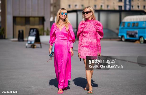 Jeannette Madsen; Thora Valdimars wearing pink dress is seen outside Munthe during the Copenhagen Fashion Week Spring/Summer 2019 on August 9, 2018...