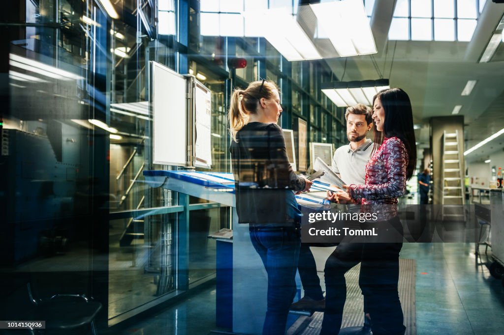 Team Of Engineers Having Discussion At Desk