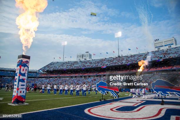 Pyrotechnics explode as the Buffalo Bills enter the field before a preseason game against the Carolina Panthers at New Era Field on August 9, 2018 in...