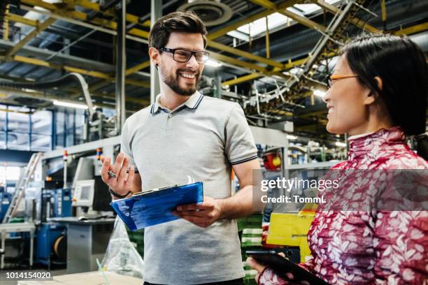 printing factory manger talking to employees - computer printing stock pictures, royalty-free photos & images