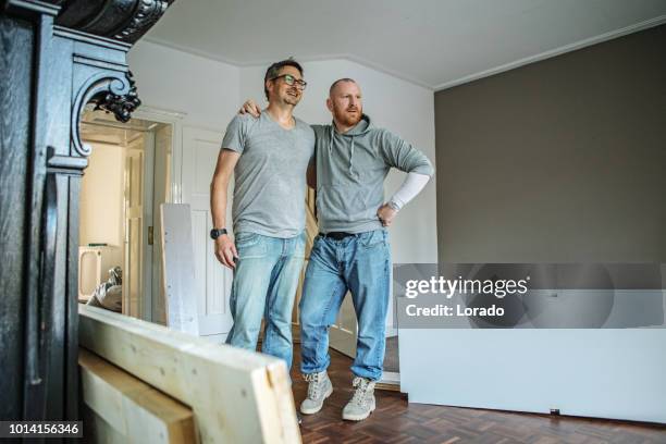 two men moving house - residential district stock pictures, royalty-free photos & images